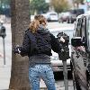 Ellen Pompeo returns to her car after buyintog tickets for the new movie Avatar.Los Angeles.