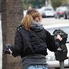 Ellen Pompeo returns to her car after buyintog tickets for the new movie Avatar.Los Angeles.