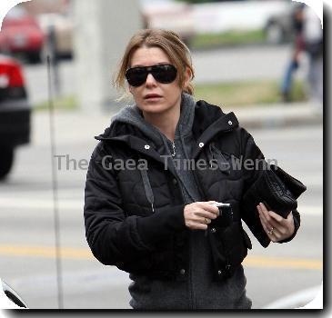 Ellen Pompeo returns to her car after buyintog tickets for the new movie Avatar.Los Angeles.