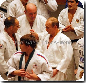 Putin shows Olympic judo team his moves
Russian Prime Minister Vladimir Putin takes part in practise sessions for the country's Olympic judo team.
  The 57-year-old politician refused to be outdone by the youngsters and showed them a few moves of his own, pinning down one daring martial artist as he demonstrated his self defence skills.
  And Putin was willing to share more of his talents with them, telling the team's trainer,