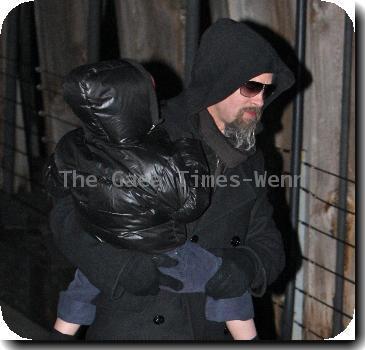 Brad Pitt carries his daughter, Zahara Jolie-Pitt, as they leave the set of 'Salt' in Manhattan.