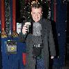 Madness lead singer Graham 'Suggs' McPherson stops by at McDaid's Pub on Harry Street for a festive pint of Guinness before heading off to play in Belfast tonight..