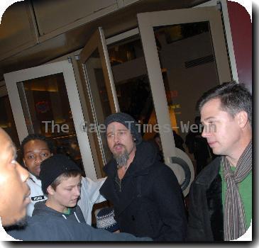 Brad Pitt and Pax Thien Jolie-Pitt seen leaving 'Dave & Busters' Restaurant in Times Square surrounded by photographers.New York City.