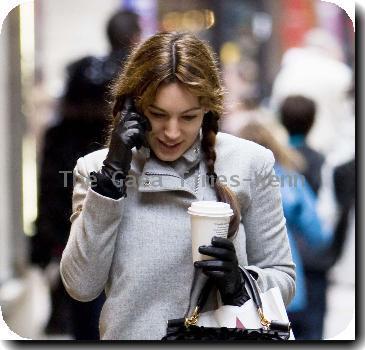 Kelly Brook 
chats on her mobile phone as she arrives for the matinee of the West End production of 'Calendar Girls' at the Noel Coward Theatre..