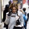 Kelly Brook 
chats on her mobile phone as she arrives for the matinee of the West End production of 'Calendar Girls' at the Noel Coward Theatre..