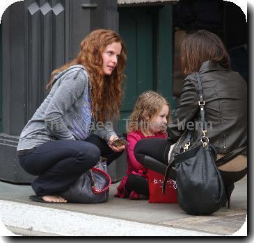 English actress Rebecca Mader stops to chat to a friend while out shopping with her daughter in Hollywood..