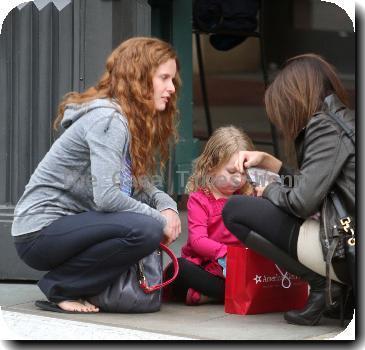 English actress Rebecca Mader stops to chat to a friend while out shopping with her daughter in Hollywood..