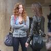 English actress Rebecca Mader stops to chat to a friend while out shopping with her daughter in Hollywood.. English actress Rebecca Mader stops to chat to a friend while out shopping with her daughter in Hollywood..
