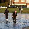 Children Playing 
on Frozen Lake in Richmond Park.