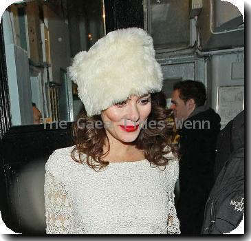 Anna Friel leaves the Royal Haymarket Theatre in a white fur hat and wearing a white crochet dress, during a snowy night after her evening performance of 'Breakfast at Tiffany's' London.