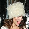Anna Friel leaves the Royal Haymarket Theatre in a white fur hat and wearing a white crochet dress, during a snowy night after her evening performance of 'Breakfast at Tiffany's' London.