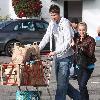 Ashley Tisdale rides on a shopping cart pushed by her boyfriend Scott Speer as they leave Trader Joe's grocery store in Toluca Lake..