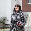 Natalie Cassidy buys two bottles of a soft drink from her local shop before returning homeLondon.