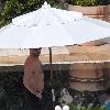 Hugh Jackman props up a parasol during a family holiday at the Copacabana Palace Hotel Rio De Janeiro.