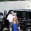 Ashley Tisdale arriving at L.A. Studios in Hollywood while wearing a bright blue dress Los Angeles.