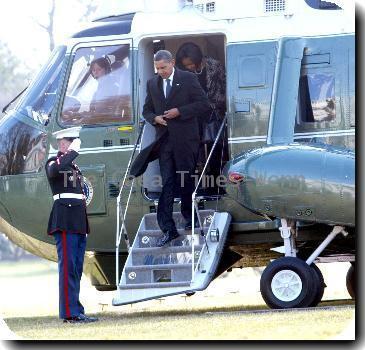 First Lady Michelle Obama and President Barack Obama 
return to the White House from Delaware after attending the funeral for Joe Biden's mother, Jean, who died Friday (08Jan10) at age 92..