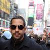 David Blaine
performs card tricks in Times Square for tourists and passers by in order to raise money for the Red Cross Haiti Earthquake Relief Fund..