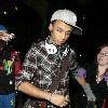 JLS singer Aston Merrygold was mobbed by dozens of female fans as he left the BBC Radio One studios after co-presenting wBBC Switch with Nick Grimshaw.