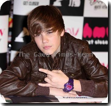 Justin Bieber signs his new album ' My World' at HMV in Westfield.