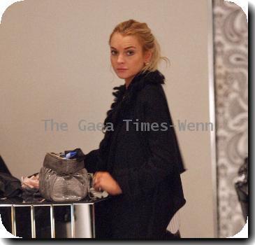 Actress Lindsay Lohan 
shopping at the Alice + Olivia Store.