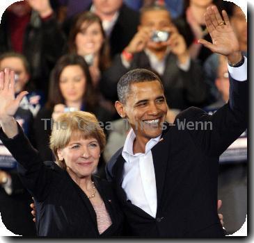 U.S. President Barack Obama joins Martha Coakley, the attorney general of Massachusetts and Democratic candidate for the U.S. Senate, during a campaign rally.