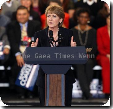 U.S. President Barack Obama joins Martha Coakley, the attorney general of Massachusetts and Democratic candidate for the U.S. Senate, during a campaign rally.