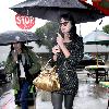 Katy Perry
holds her umbrella while leaving Cravings restaurant in Los Feliz after having lunch with a friend.