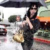 Katy Perry
holds her umbrella while leaving Cravings restaurant in Los Feliz after having lunch with a friend.