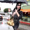 Katy Perry
holds her umbrella while leaving Cravings restaurant in Los Feliz after having lunch with a friend.