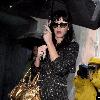 Katy Perry
holds her umbrella while leaving Cravings restaurant in Los Feliz after having lunch with a friend.