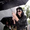 Katy Perry
holds her umbrella while leaving Cravings restaurant in Los Feliz after having lunch with a friend.