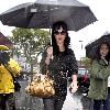 Katy Perry
holds her umbrella while leaving Cravings restaurant in Los Feliz after having lunch with a friend.