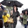 Katy Perry
holds her umbrella while leaving Cravings restaurant in Los Feliz after having lunch with a friend.