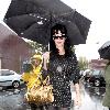 Katy Perry
holds her umbrella while leaving Cravings restaurant in Los Feliz after having lunch with a friend.