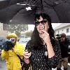 Katy Perry
holds her umbrella while leaving Cravings restaurant in Los Feliz after having lunch with a friend.