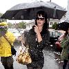 Katy Perry
holds her umbrella while leaving Cravings restaurant in Los Feliz after having lunch with a friend.