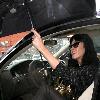 Katy Perry
holds her umbrella while leaving Cravings restaurant in Los Feliz after having lunch with a friend.