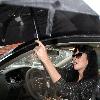 Katy Perry
holds her umbrella while leaving Cravings restaurant in Los Feliz after having lunch with a friend.