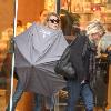 Alyson Michalka still wearing sunglasses, braves the rain as she opens her Four Seasons hotel umbrella leaving Anastasia salon in Beverly Hills Los Angeles.