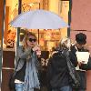 Alyson Michalka still wearing sunglasses, braves the rain as she opens her Four Seasons hotel umbrella leaving Anastasia salon in Beverly Hills Los Angeles.