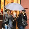 Alyson Michalka still wearing sunglasses, braves the rain as she opens her Four Seasons hotel umbrella leaving Anastasia salon in Beverly Hills Los Angeles.