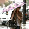 Brittany Snow walking in the rain in decorative studded boots after getting her eyebrows done at Anastasia in Beverly Hills Los Angeles.