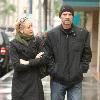 Michael Biehn out and about in Beverly Hills wearing a beiny hat in the rain walking with Jennifer BlancLos Angeles.