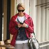 Stacy Keibler texting on her cellphone as she arrives at Starbucks for coffee in Hollywood Los Angeles.