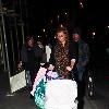 Coleen Rooney 
pushes her son Kai in a stroller while out shopping with her mum.