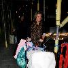 Coleen Rooney 
pushes her son Kai in a stroller while out shopping with her mum.