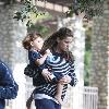 Amanda Peet and daughter Frances Penpregnant at the Coldwater Park and making funny faces as she carries her daughter to her carBeverly Hills.