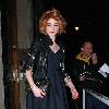 Girls Aloud singer, Nicola Roberts leaves Radio 1 with knee length stockings and a leather jacket.
