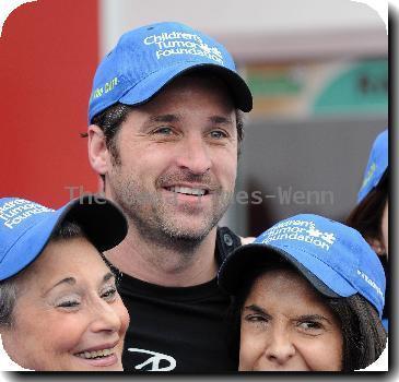 Patrick Dempsey signs autographs prior to the Rolex 24 hours of Daytona road race at Daytona International Speedway  Daytona Beach.