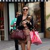 Miranda Kerr 
shopping at Victoria Secrets with her dog..